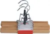 A set of wooden pants hangers with silver metal clips against a white background. Produktbild-Vorschau