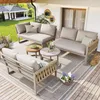 An outdoor patio setting with a modular sofa set, coffee tables, and decorative items. Voir les images du produit