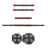 A collection of dumbbell bars and weight plates arranged on a white background. Produktbild-Vorschau