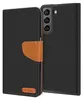 A black flip case for a Samsung Galaxy S22 Plus phone, with a brown leather strap and a small brown logo on the bottom left. Náhled obrázku produktu