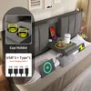 A bed with integrated features like cup holders and charging ports. Produktbild-Vorschau