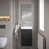 A modern bathroom with a wall-mounted sink and vanity. Anteprima dell’immagine prodotto
