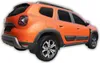 Rear three-quarter view of an orange Dacia Duster SUV with black trim and silver wheels, isolated on a white background. Náhľad obrázku produktu