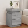 A bedside table with two drawers next to a bed. Podgląd zdjęcia produktu