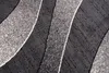 A close-up view of a rug with a modern abstract pattern. Náhľad obrázku produktu