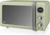 A retro-style green microwave oven is shown from a front-side angle against a white background. Voir les images du produit