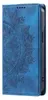 A blue flip-style phone case with a mandala design embossed on the cover. Produktbild-Vorschau