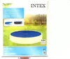 The image shows the packaging of an Intex pool cover, with a picture of the pool cover itself on the box. Náhľad obrázku produktu