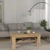 A living room scene with a couch, coffee table, and a floor lamp. Produktbild-Vorschau