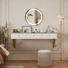 A bedroom vanity setup with a floating desk, mirror, stool, and lamp. Voir les images du produit