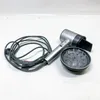 A silver and black hairdryer with a diffuser attachment and its cord are laid out on a white surface. Produktbild-Vorschau
