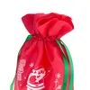 A close-up of the top of a red Christmas gift bag with white Santa Claus and snowflake designs, and green ribbon ties. Produktbild-Vorschau
