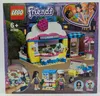 The image shows the LEGO Friends Olivias Cupcake-Café playset packaging, featuring the assembled toy, mini-figures, and promotional artwork. Náhled obrázku produktu