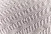 A close-up view of a herringbone patterned blanket. Produktbild-Vorschau