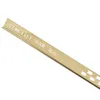 A close-up, angled shot of a gold-colored metal profile strip against a white background. Produktbild-Vorschau