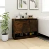 A wooden sideboard with three doors and open shelves below, placed in a room with a plant and framed pictures on top. Náhled obrázku produktu