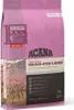A bag of dog food with a scenic image of trees and mountains. Voir les images du produit