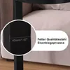 A close-up view of a table leg and a portion of a sofa. Produktbild-Vorschau