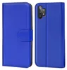 A blue flip case for a smartphone is shown from the front and back. Podgląd zdjęcia produktu