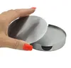A hand holding up one metal coaster from a set of coasters in a metal holder. Produktbild-Vorschau