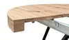 A close-up view of the edge of a round table with a wood-grain finish and metal support structure underneath. Produktbild-Vorschau