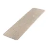 A rectangular beige stair mat with a textured surface is shown on a white background. Anteprima dell’immagine prodotto