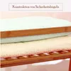 Stacked towels on a wooden shelf. Produktbild-Vorschau