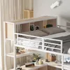 A loft bed with a desk and shelves underneath, set up in a bedroom. Voir les images du produit