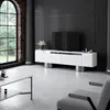 A modern living room with a white TV stand, a large arched window, and a grey armchair. Voir les images du produit