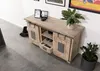 A wooden sideboard with sliding doors, decorated with plants and framed pictures. Voir les images du produit
