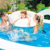 A family is enjoying a day in an inflatable swimming pool. Podgląd zdjęcia produktu