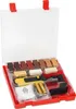 A red and clear plastic case containing a wood repair kit, including a heat gun, various colored repair sticks, batteries, and a cleaning cloth. Náhled obrázku produktu