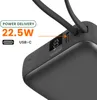 Close-up of a black power bank with a digital display showing battery percentage and charging indicators. Produktbild-Vorschau