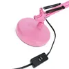 A close-up shot of the base and switch of a pink desk lamp. Anteprima dell’immagine prodotto