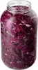 A clear, well-lit studio shot of a large glass jar filled with chopped red cabbage, likely for pickling or fermentation. Podgląd zdjęcia produktu