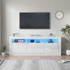 A modern white TV stand with LED lighting, displaying various electronic devices and decorative items. Produktbild-Vorschau