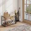 An entryway scene with a shoe rack, handbags, and umbrellas. Produktbild-Vorschau