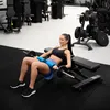 A woman is performing a hip thrust exercise in a gym. Náhled obrázku produktu