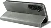 A gray flip case for a smartphone is shown open, revealing the phone's camera array. Produktbild-Vorschau
