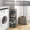 A narrow storage trolley is placed next to a washing machine, with a laundry basket in the background. Podgląd zdjęcia produktu