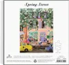 The image shows the packaging of a jigsaw puzzle, featuring the puzzle's artwork on the front. The artwork depicts a colorful street scene with people, cars, and buildings. Anteprima dell’immagine prodotto
