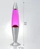 A lava lamp with pink liquid and a silver base and top, shown against a light gray background with measurement indicators. Produktbild-Vorschau