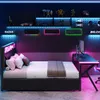 A gaming-themed bedroom with a bed, desk, and shelves, illuminated by LED lights. Voir les images du produit