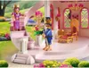 A fairy tale-themed play set depicting a royal couple in a castle garden. Voir les images du produit