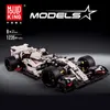 A detailed model of a racing car, likely a building block set, displayed on a dark background with branding and product information. Náhľad obrázku produktu