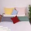 A collection of pillows arranged on a bed. Produktbild-Vorschau