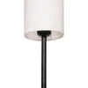 A close-up of the top part of a black floor lamp with a white cylindrical lampshade. Náhľad obrázku produktu