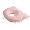 A pink baby pillow with a hole in the center, shown on a white background with dimensions indicated. Podgląd zdjęcia produktu