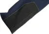 A close-up view of the bottom hem of a pair of dark blue work pants, featuring a black reinforced patch with visible stitching. Produktbild-Vorschau