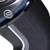 A close-up view of a black electric shaver, focusing on the textured grip and a silver emblem with the number '5D'. Produktbild-Vorschau